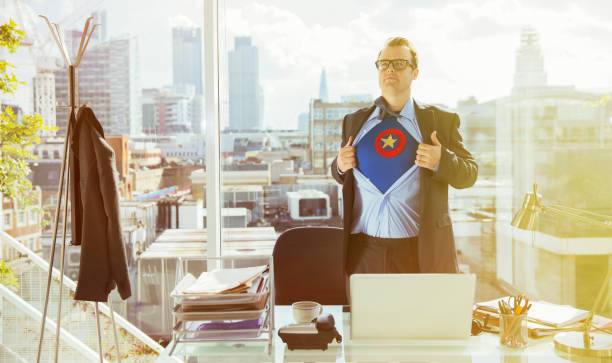 businessman revealing superhero costume under suit - antivirus software fotos imagens e fotografias de stock