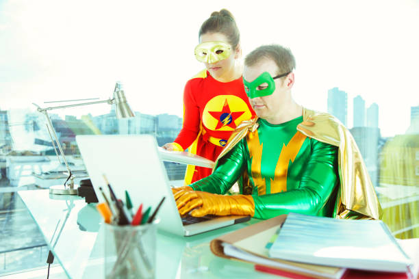 istock Superheroes working with laptop in office 534573549