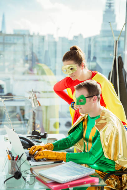 superheroes working on laptop in office - superhero humor men cape imagens e fotografias de stock