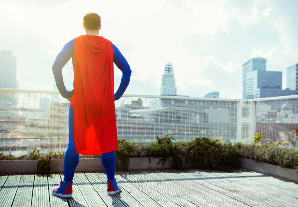 istock Superhero looking at view from city rooftop 534573891