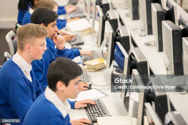 Teenage Students Using Computers In Computer Room Stock Photo - Download Image Now - Education, Technology, Computer