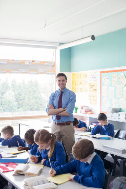 istock Teacher and primary school children in classroom during lesson 534576507