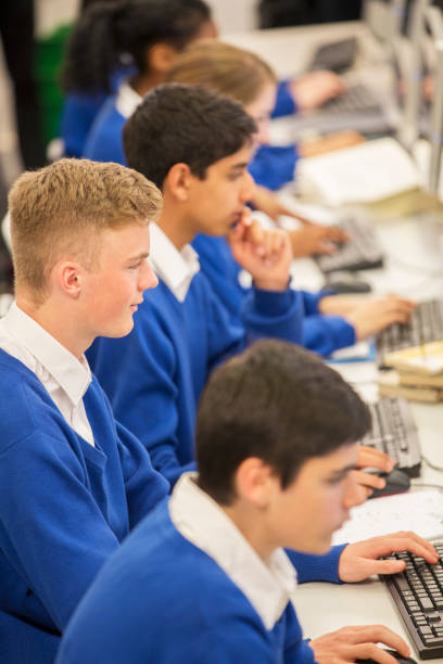Computer Students Uniform Design 7,900+ Students On Computer In Uniform Stock Photos, Pictures & Royalty ...