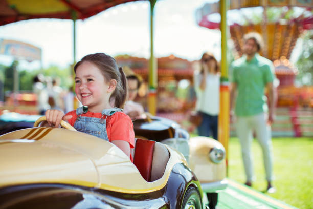 istock Cheerful girl on carousel in amusement park 534577089
