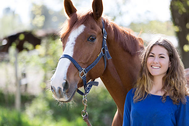 istock pretty girl with her horse 534595110