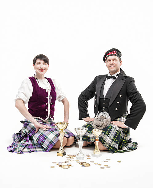 istock The pair dancing Scottish dance with cups and medals 534595196