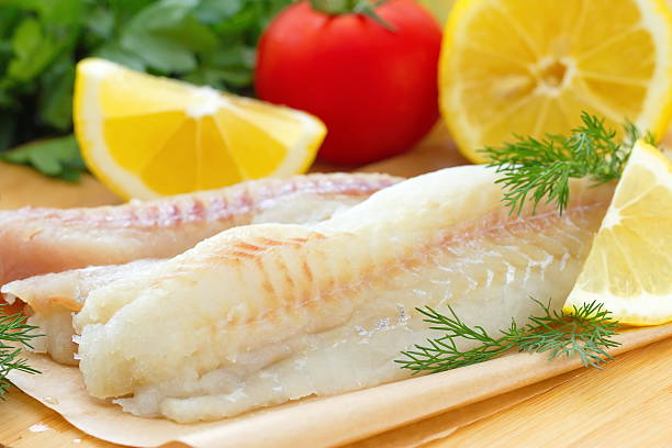 istock Raw fish with spices, lemon and vegetables 534595298