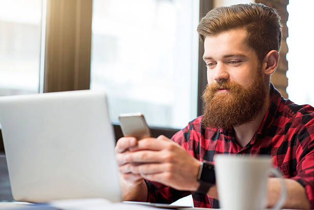 istock Positive  bearded man sitting at the table 534595478