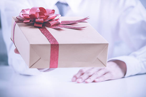 istock Business man offering a gift 534595794