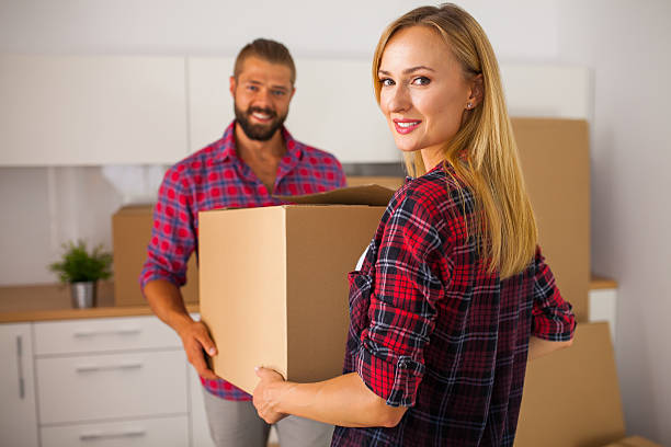 Young couple just move to their new apartment. stock photo