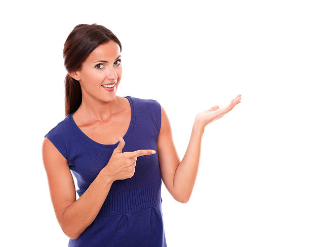 istock Pretty woman pointing to her left 534600309