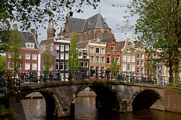 istock Amsterdam city. View with bridge and typical dutch houses 534601381