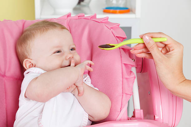 Cute baby eating stock photo