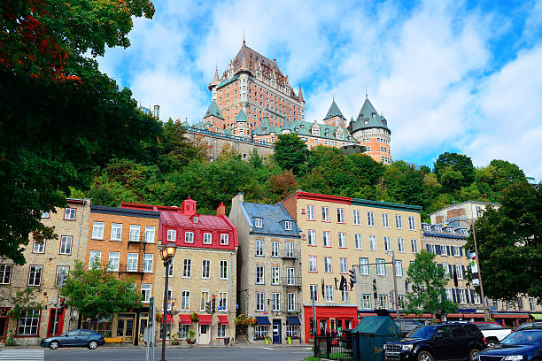 Chateau Frontenac in the day Chateau Frontenac in the day with colorful buildings on street in Quebec City quebec stock pictures, royalty-free photos & images