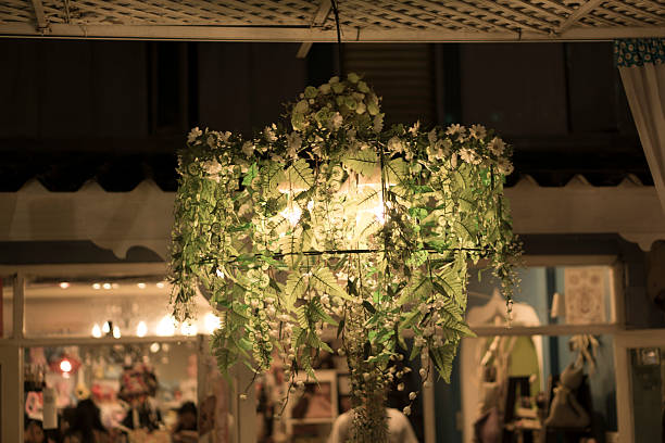 istock Light bulb wooden lamp illuminating flowers 534601757