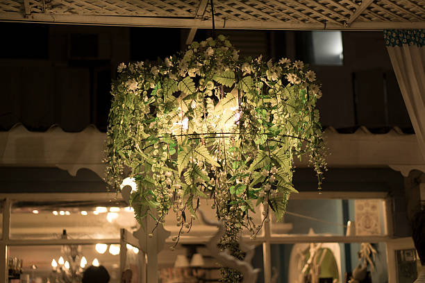 istock Light bulb wooden lamp illuminating flowers 534601777