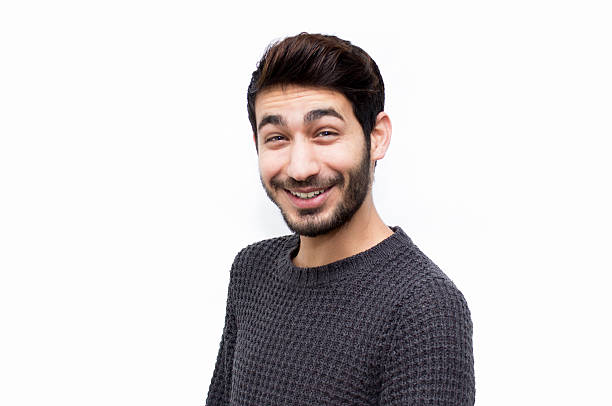 istock Portrait of smiling young man over white background 534603340