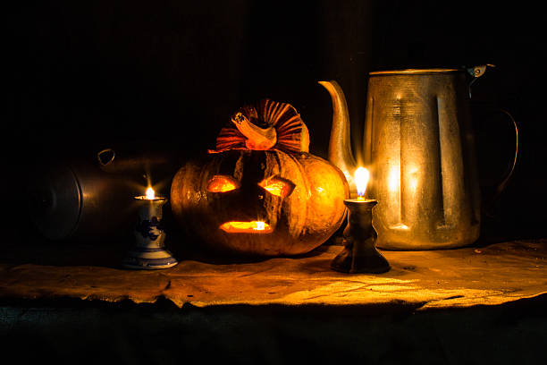 istock Halloween still life with pumpkins,  candles and classic kettle 534607891