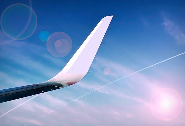 istock Wing of an airplane flying above the clouds 534609145
