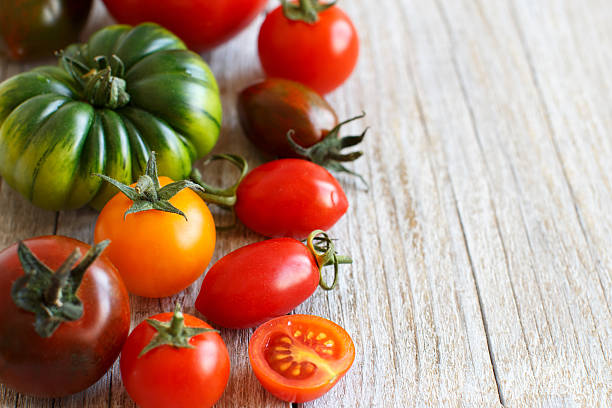 istock Colorful tomatoes on a wooden table 534609294
