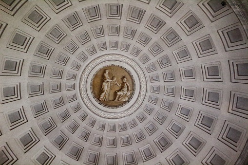 Architectural detail of the ceiling of the coffered dome of the Pantheon. The Pantheon ('to every god') in the Piazza della Rotonda in Rome, Italy was built by Marcus Agrippa in 27 BC and rebuilt by Emperor Hadrian in about 126 AD. The concrete for the coffered dome was poured in moulds, probably mounted on temporary scaffolding. The oculus (round opening on top of the dome) is the main source of natural light.