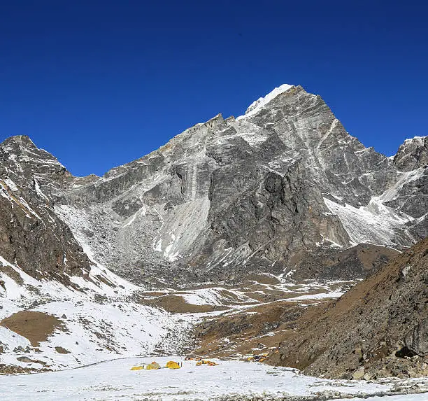 Solukhumbu, Nepal - October 31 2013: Trekker with cholatse basecamp in everest trek route