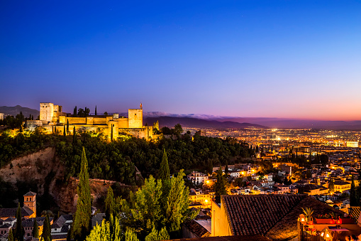Granada, Spain - May 1, 2023: Panoramic view of the Alhambra at dusk (Granada, Spain).