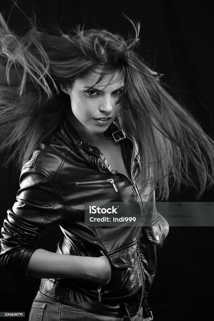 Pretty girl on the go Pretty girl on the go a black background and long hair Brown Stock Photo