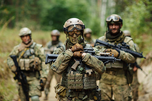 istock soldier stands with arms and looks forward 534635555