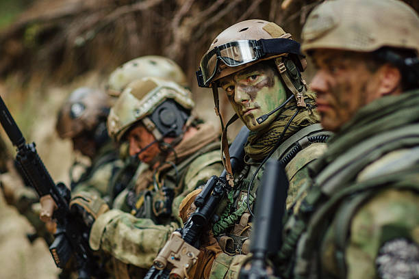 istock soldier aims his weapon in sight 534635587