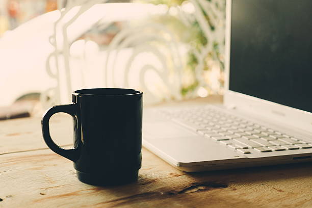 istock vintage color tone : cup of coffee in coffee shop 534637153