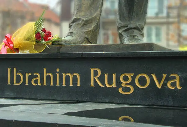Photo of Flowers at Ibrahim Rugova statue in Pristina, Kosovo