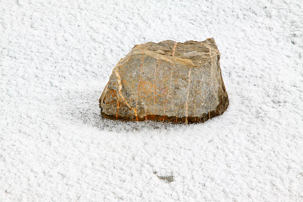 istock grey stones in the snow 534638133