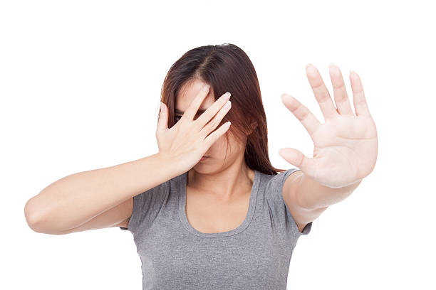 istock Young Asian woman hide her face with hand 534639189