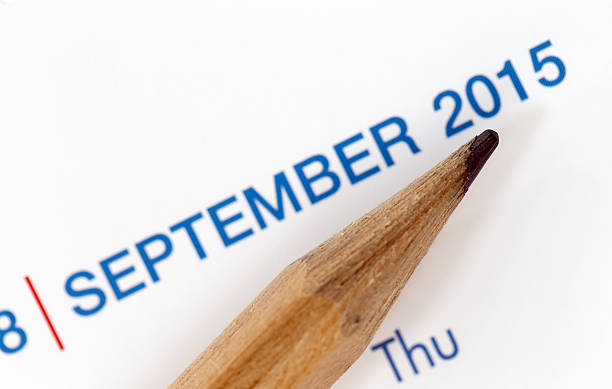 istock The tip of a pencil point to year blur Text. 534639853