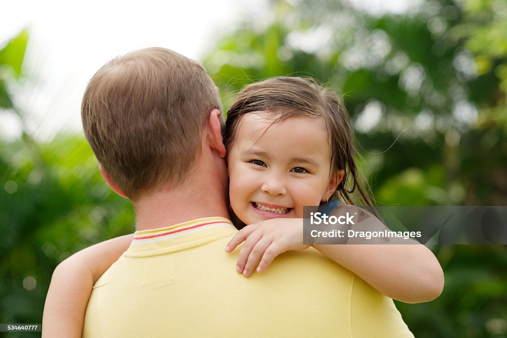 Carrying daughter Father holding cheerful little girl 2015 Stock Photo