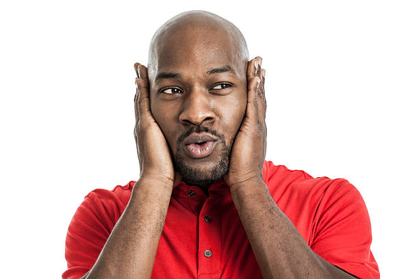 istock Handsome black man covering ears 534640867