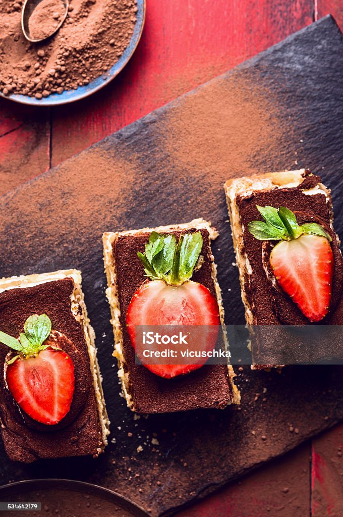 tiramisu cake with strawberries slices on slate, top view 2015 Stock Photo