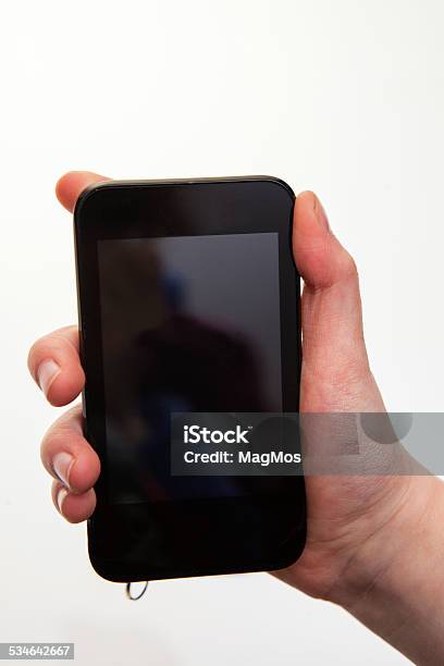 Hand Holding Smartphones With Blank Screen Stock Photo - Download Image Now - 2015, Adult, Black Color