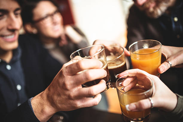 istock group of friends toasting with drinks 534642725