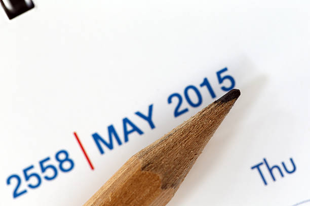 istock The tip of a pencil point to year blur Text. 534642901