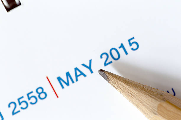 istock The tip of a pencil point to year blur Text. 534642903
