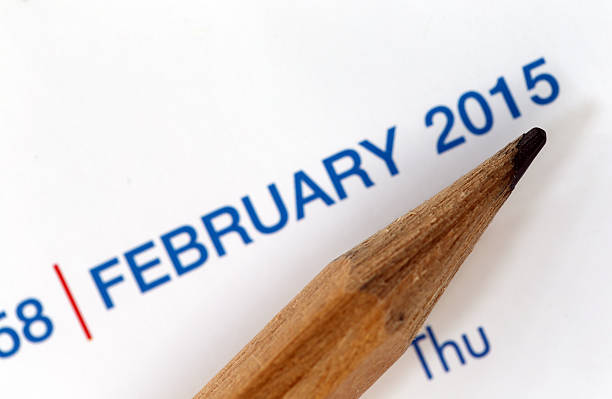 istock The tip of a pencil point to year blur Text. 534643259