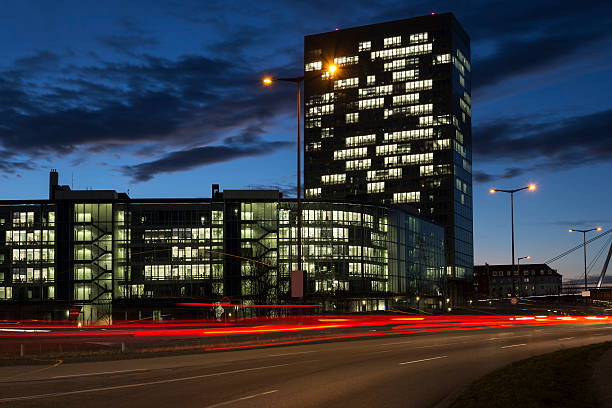 istock Busy road with office buildings at night 534643395