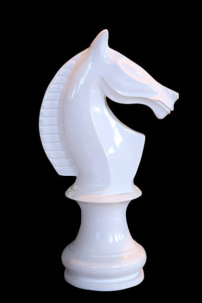 istock White horse chess isolated on black background 534643867