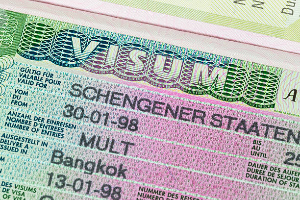 istock Schengen visa in passport macro 534663879