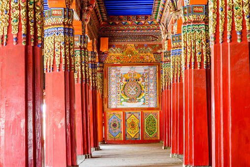 decorated ceiling and pillar in tibetan buddhism temple