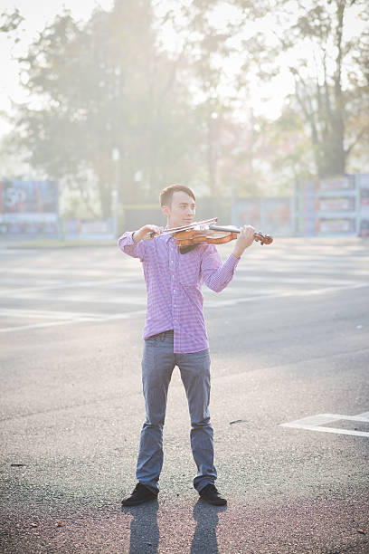 istock young crazy funny musician violinist asian man 534665449