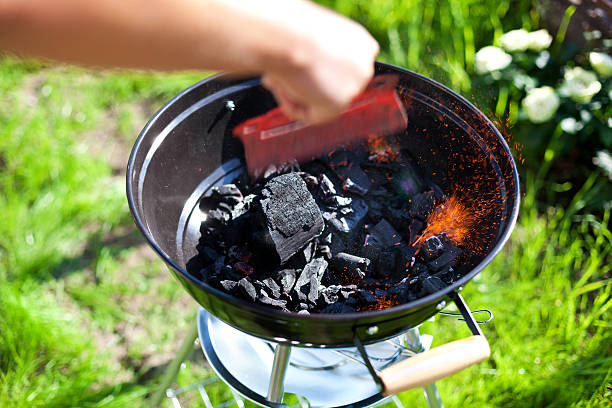 istock Barbecue charcoal in fire, preparing for grilling 534666037