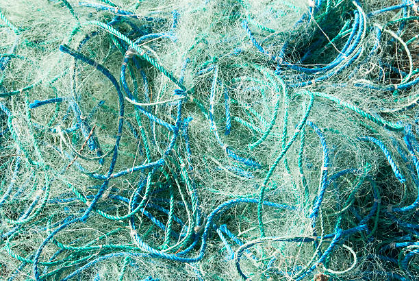 Fish net background Blue fish net fishing boat sinking stock pictures, royalty-free photos & images